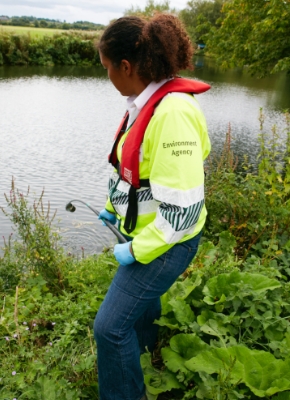 Environment officer conducting water sampling