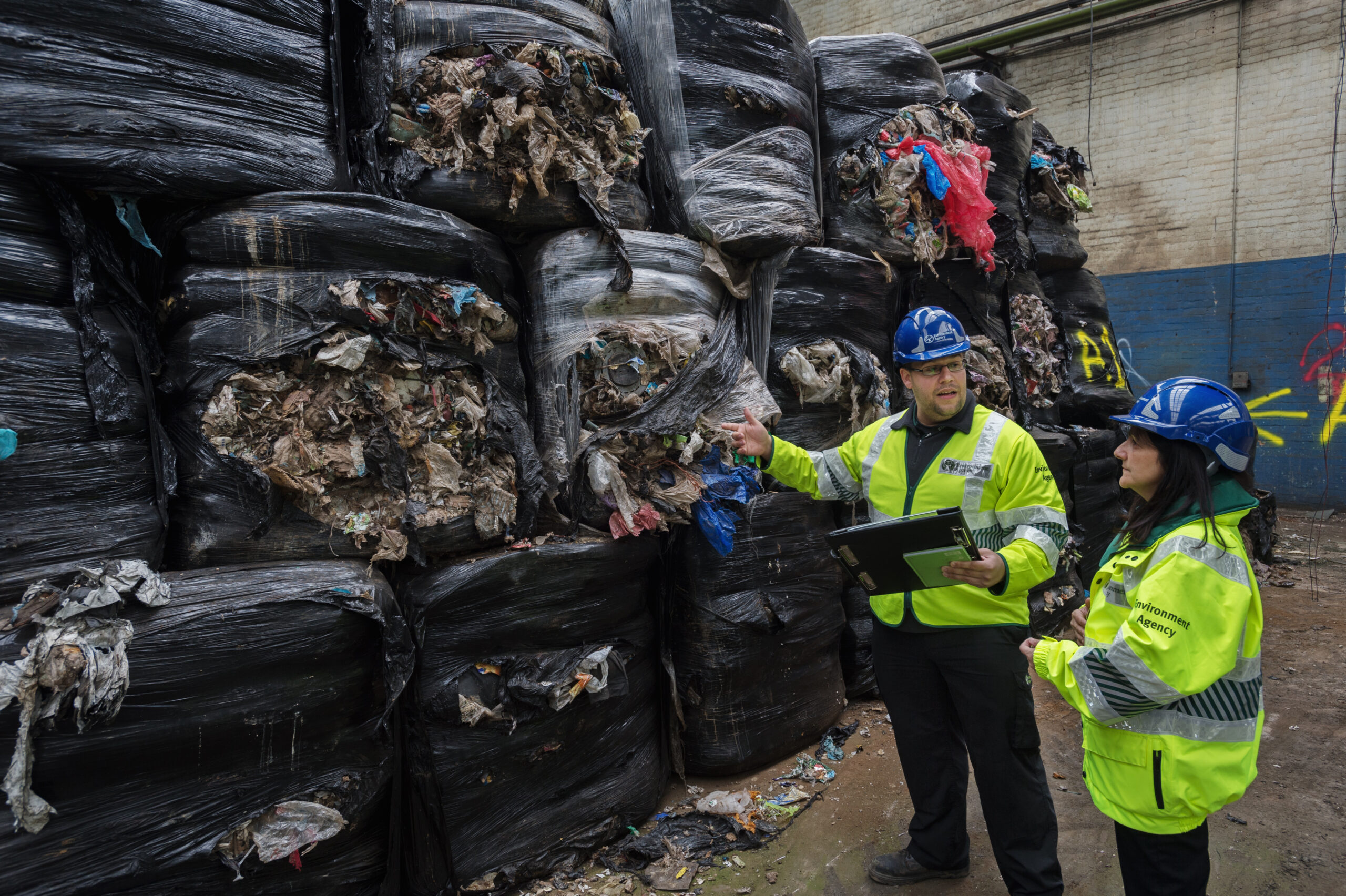 EA staff inspecting a local waste site