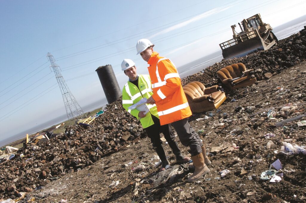 environment officer-and customer at a landfill site scaled