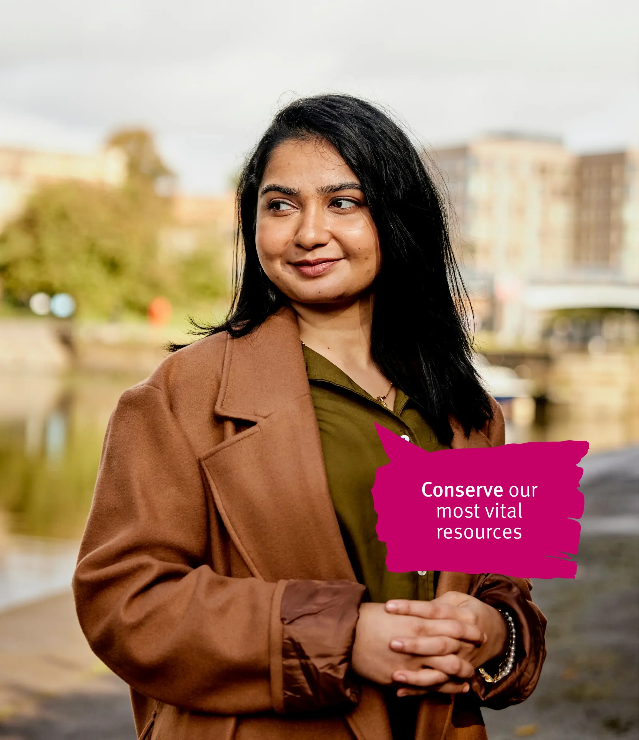 Women in brown coat standing 