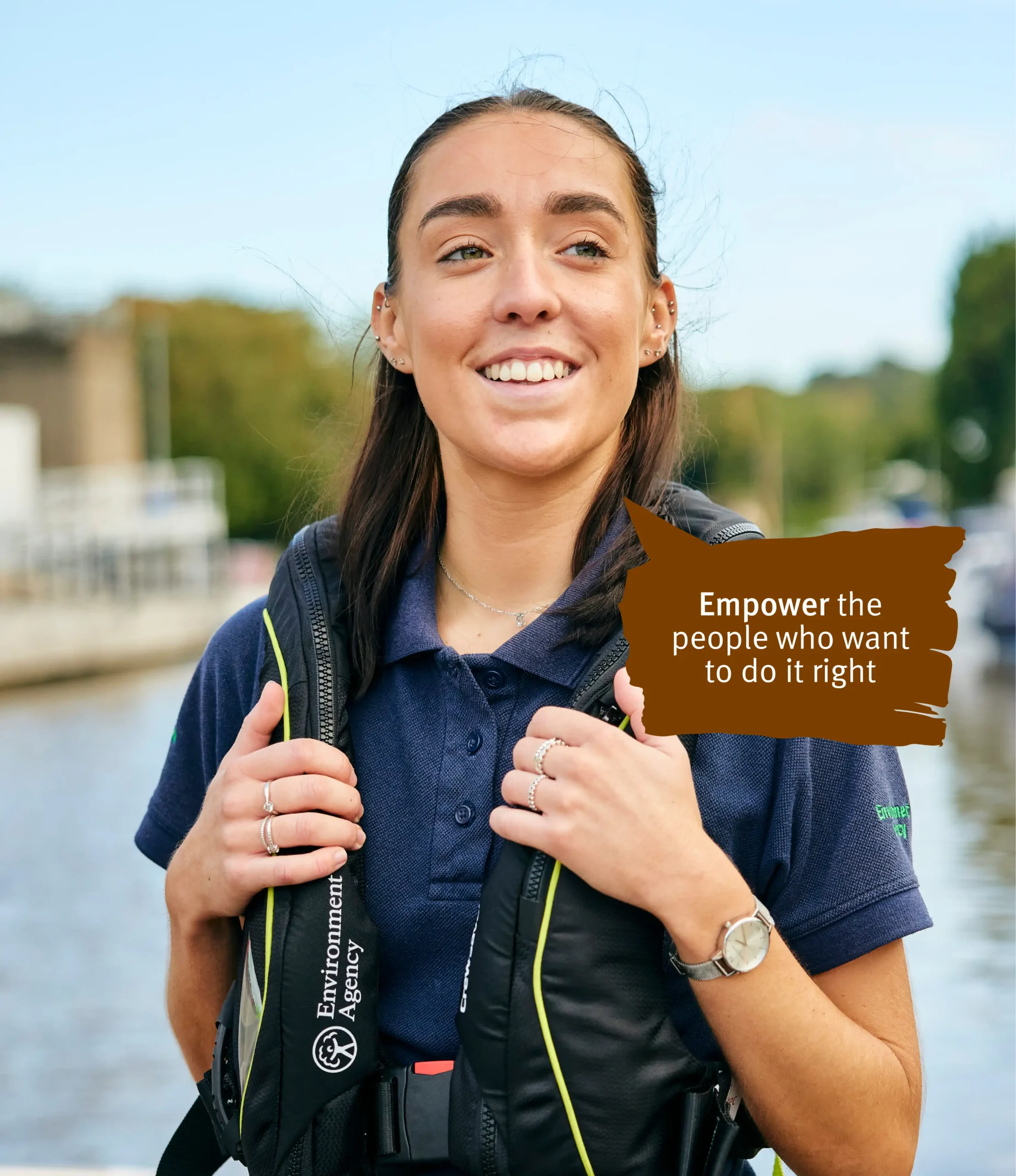 Girl standing besides the lake