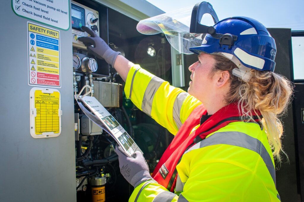 EA team member carrying out maintenance while wearing PPE